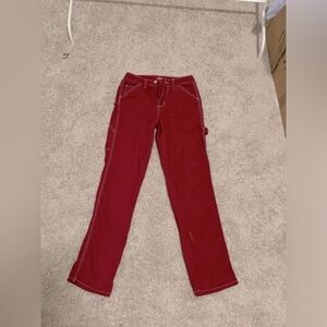 Dolls kill Burgundy Dickies pants.